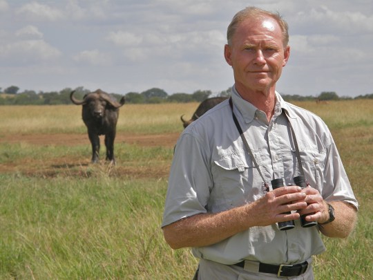 Tony Sinclair in the field studying wildebeest in the Serengeti.